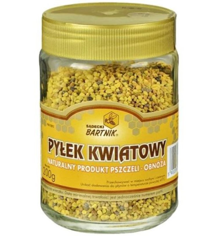 Glass i gult med brun skrift og gullfarget lokk